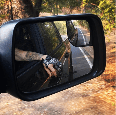 Angie prosthetic in car mirror